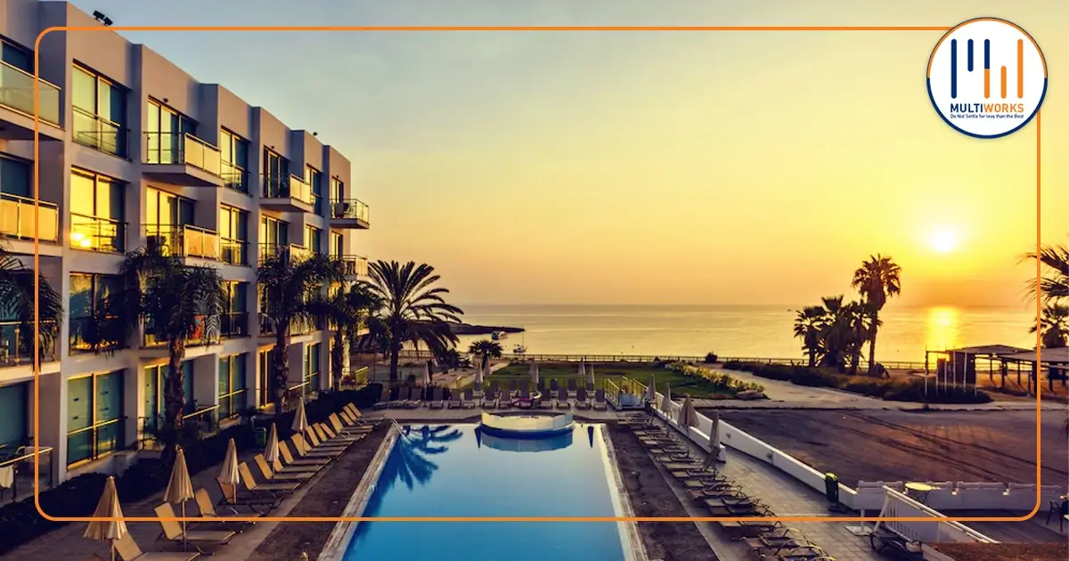 Oceanfront hotel with poolside view and sunset overlooking the sea