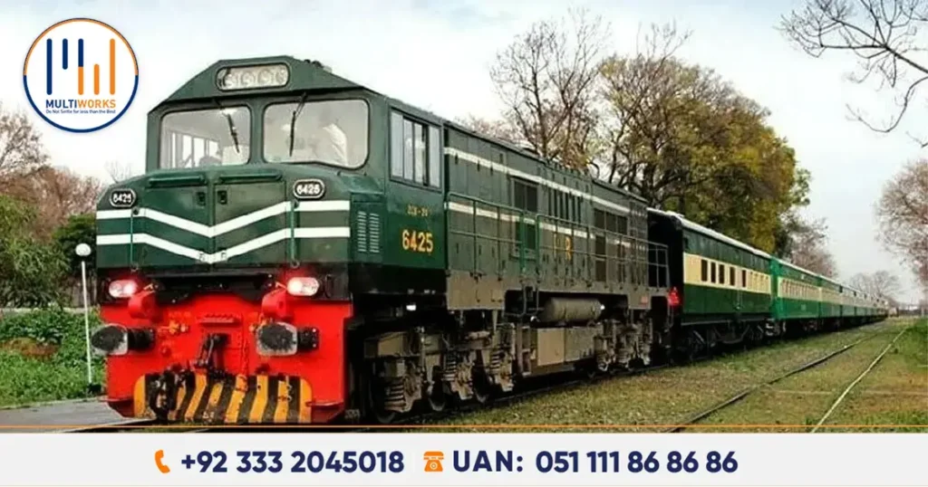 Green-line train by Pakistan Railways on a lush route, enhancing travel between Lahore and Karachi.