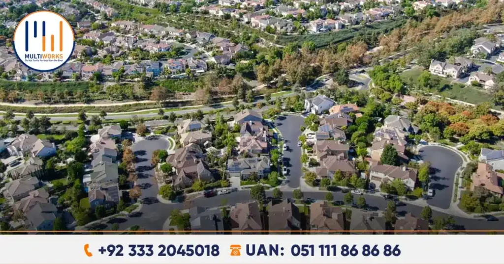 Aerial view of private housing societies in Islamabad, CDA Chairman calls for stricter regulations to ensure compliance and resident welfare.