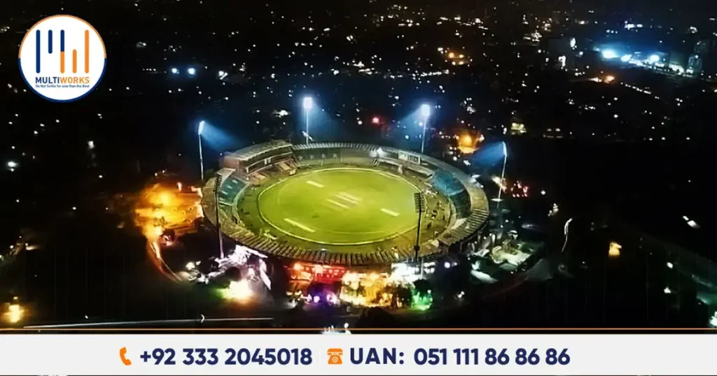 Aerial view of Islamabad cricket stadium at night with bright floodlights and seating for over 50,000 spectators.